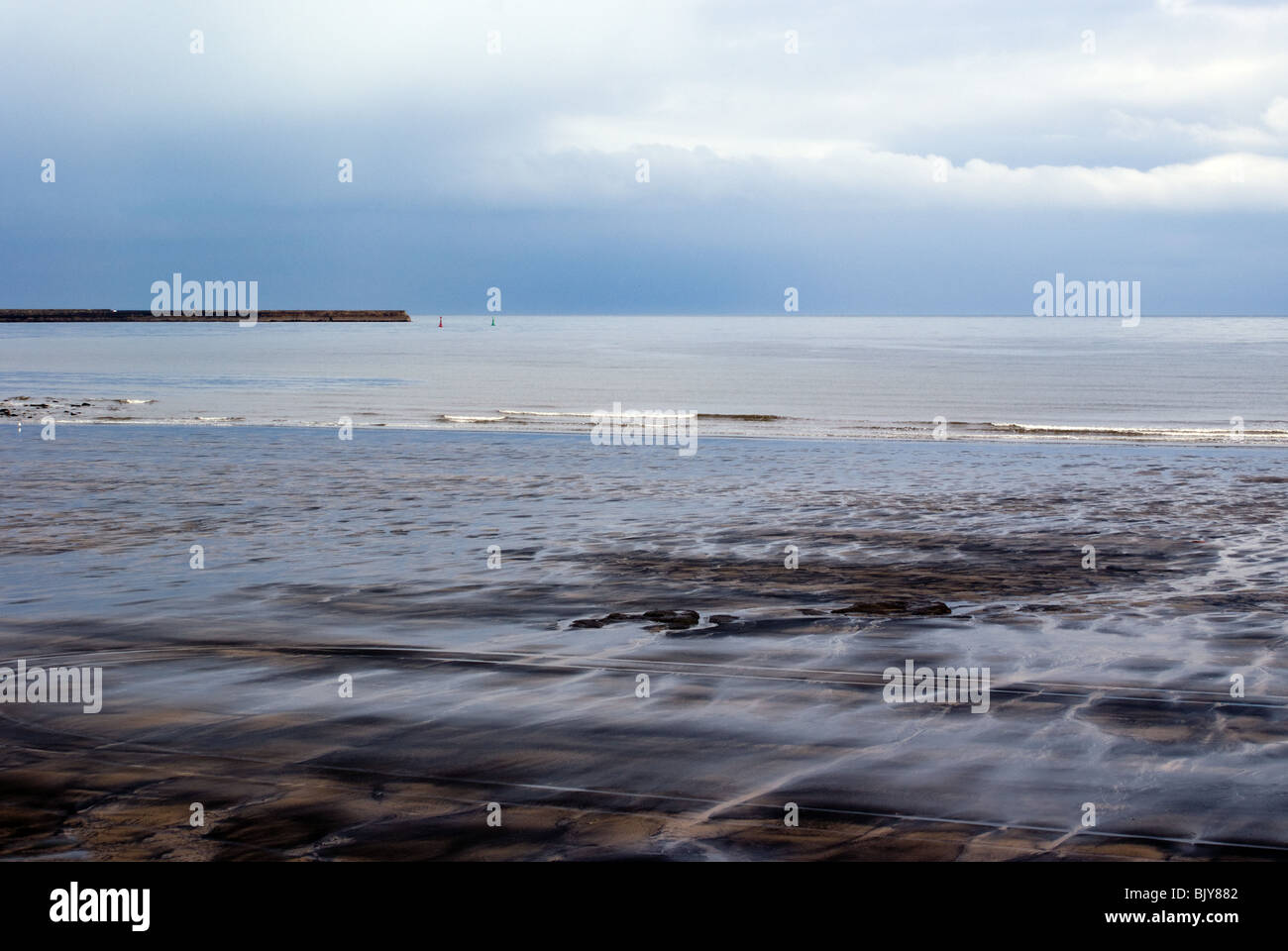 SEATON CAREW BEACH HARTLEPOOL WITH SEA COAL WASHED UP ON THE BEACH AT LOW TIDE Stock Photo Alamy