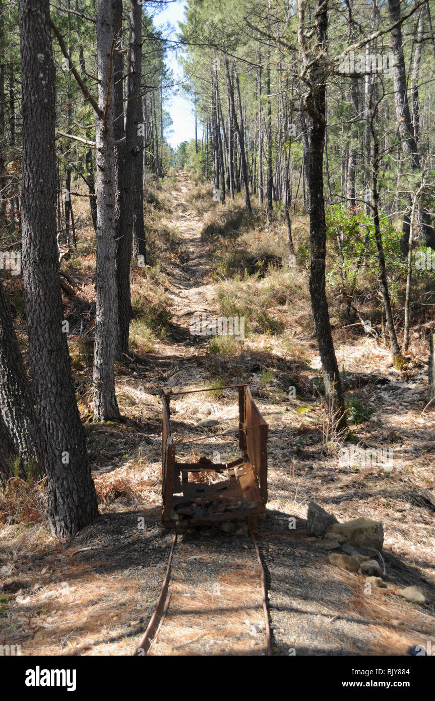 An abandoned wagon gives visitors to get an impression of an inclined plane, near Banne in the Ardeche departement of France. Stock Photo