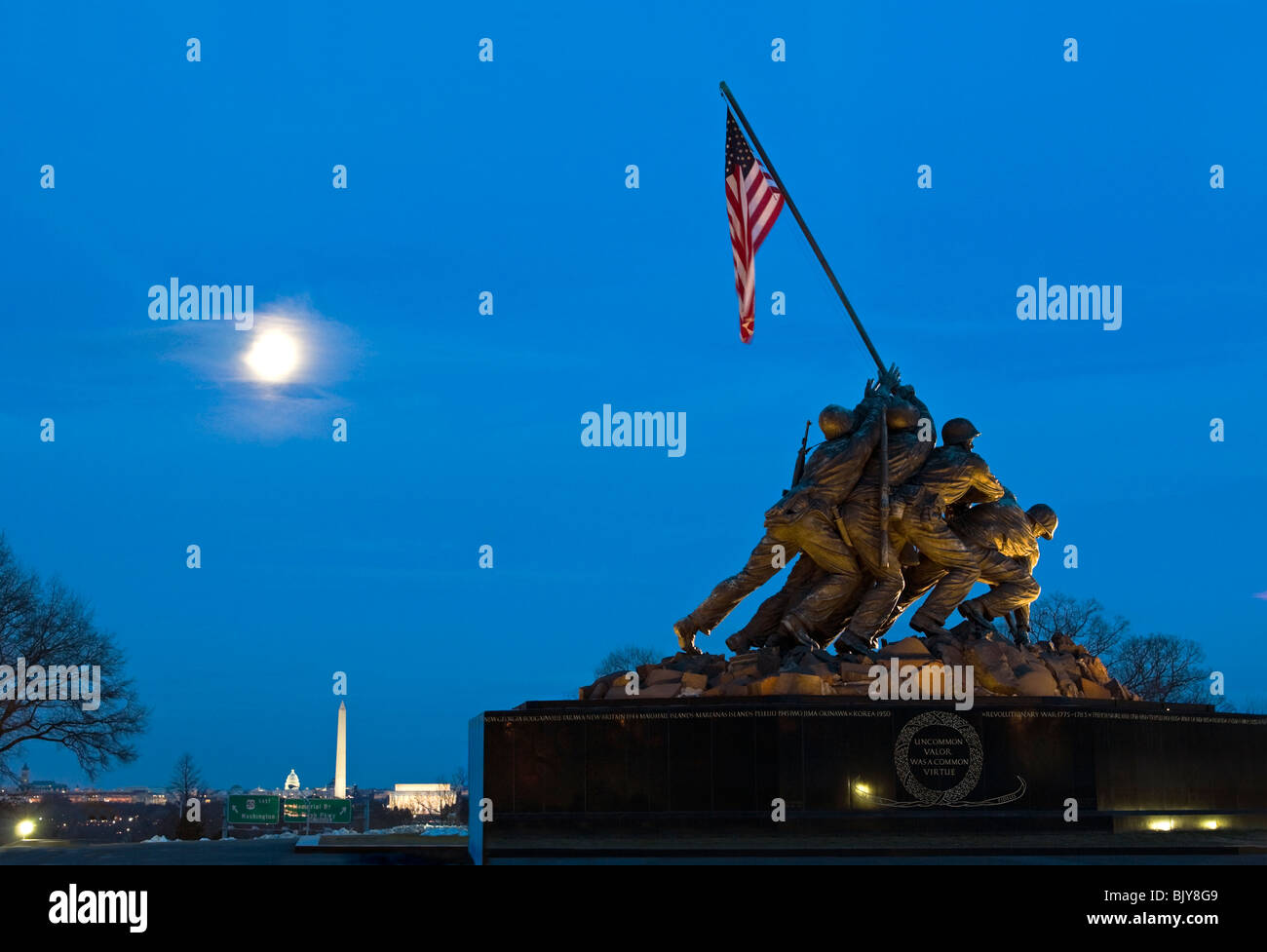Iwo Jima Memorial in Arlington Virginia with full moon in the background Stock Photo