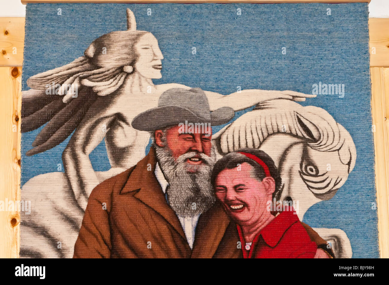 Tapestry of Korczak Ziolkowski and his wife, Ruth in front of a model of the Crazy Horse Memorial, South Dakota, USA Stock Photo