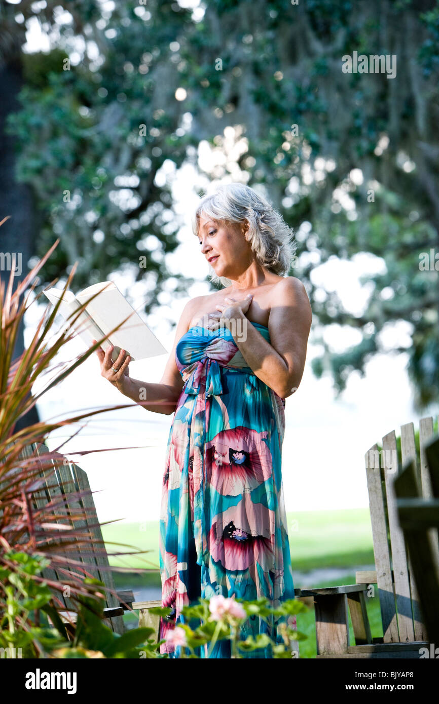Middle aged woman floral print dress hi-res stock photography and images -  Alamy