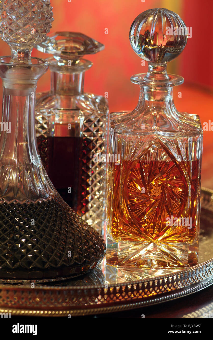 decanters with cherry and whiskey Stock Photo