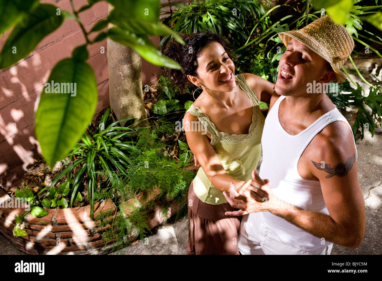 Romantic young couple dancing together outdoors Stock Photo - Alamy