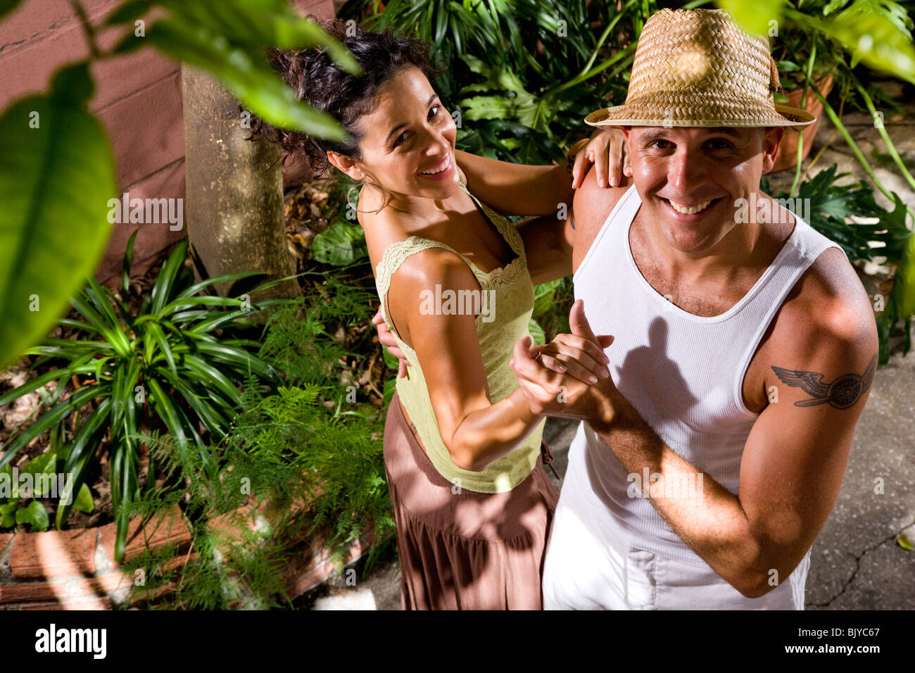 Romantic young couple dancing together outdoors Stock Photo - Alamy