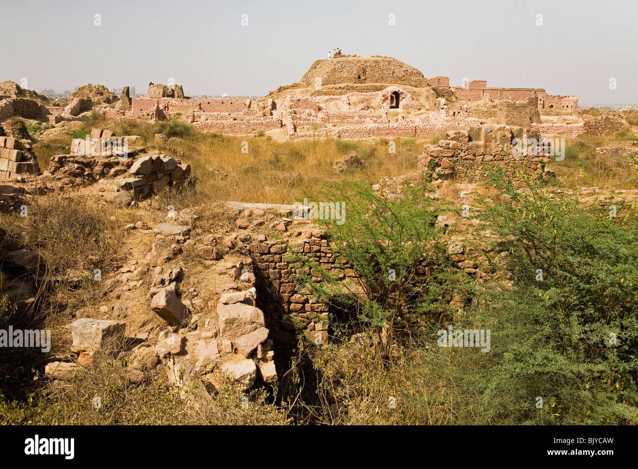 The ruined citadel of Tughluqabad Fortress, constructed under Ghiyas-ud-Din in 1321 AD, in Delhi, India Stock Photo