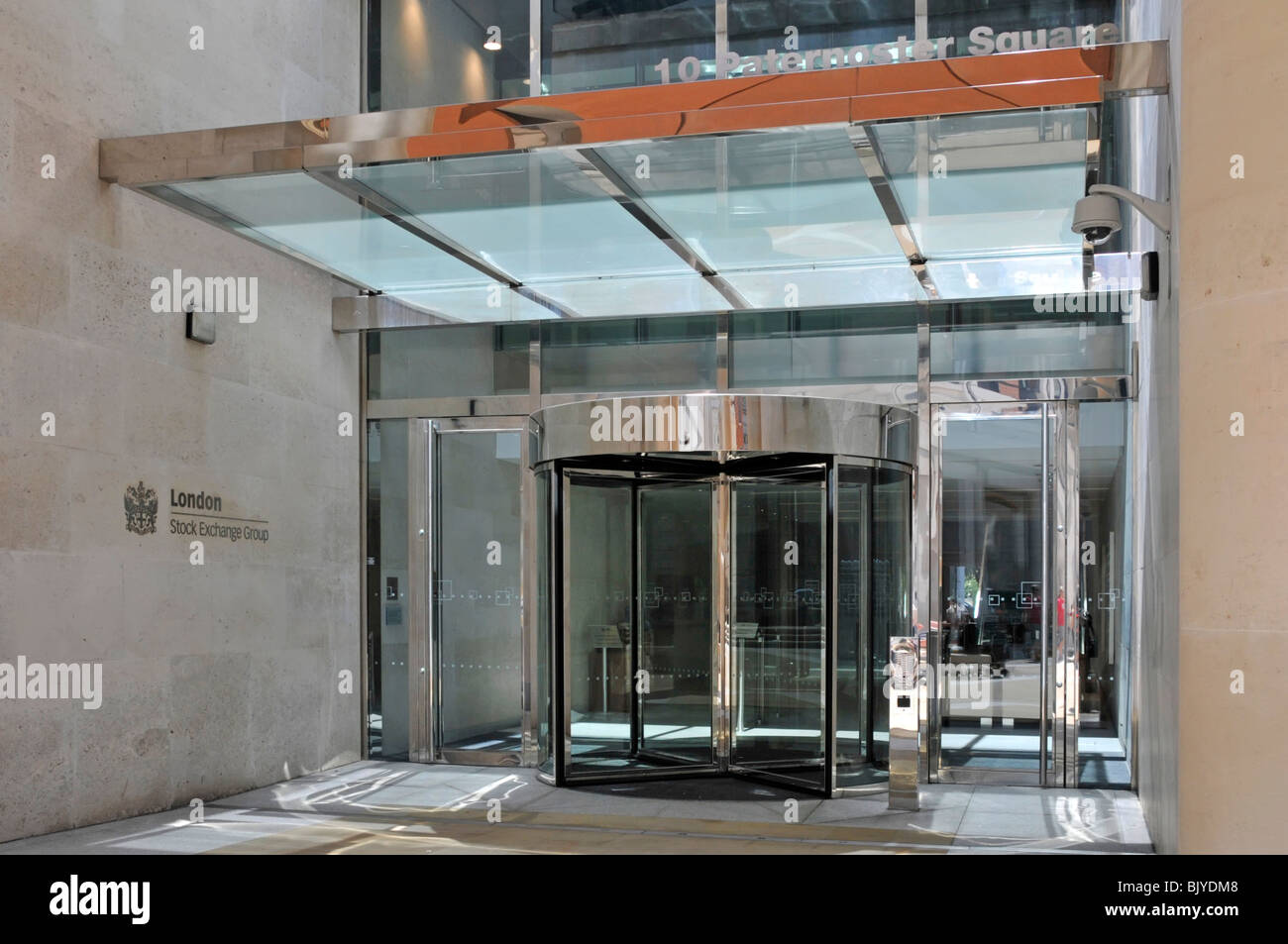 Glazed canopy above revolving door entrance to the London Stock Exchange at 10 Paternoster Square in financial district of City Of London England UK Stock Photo