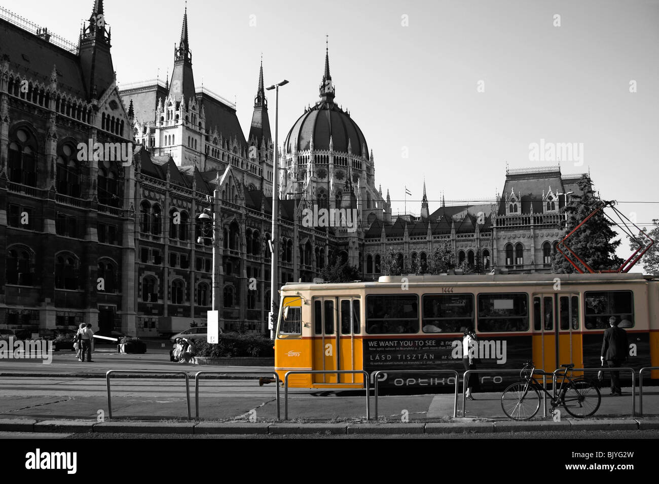 Yellow tram outside the Hungarian Parliament building, Pest, Budapest, Hungary Stock Photo