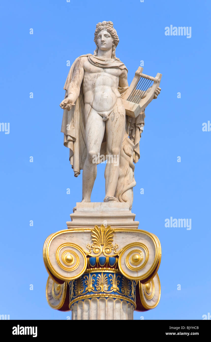 Apollo statue with golden decorations against blue sky Stock Photo