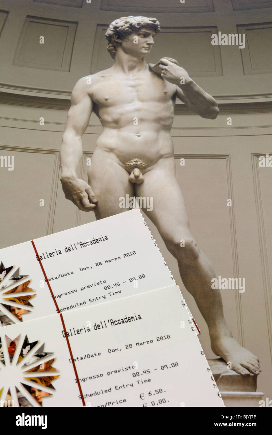 Two entrance tickets to the Galleria dell' Accademia. On the background is the most famous scuplture of the Western art, David.. Stock Photo