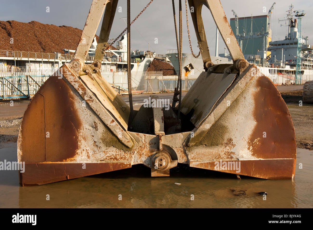 Clam shell crane bucket Stock Photo