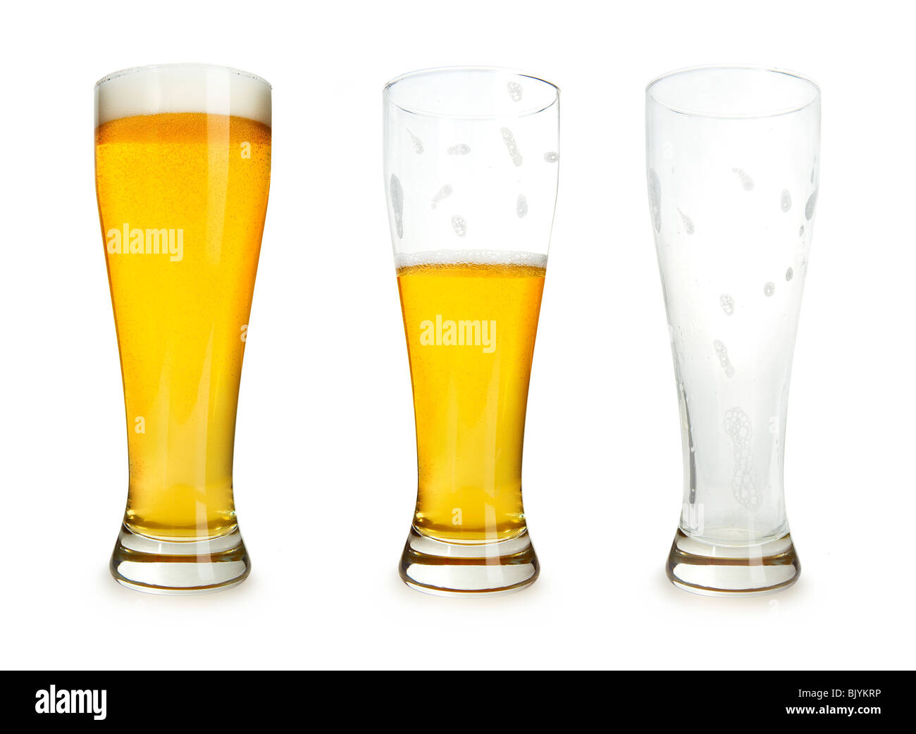 Three glasses of beer with one full, one half gone, and one empty on a white background. Stock Photo