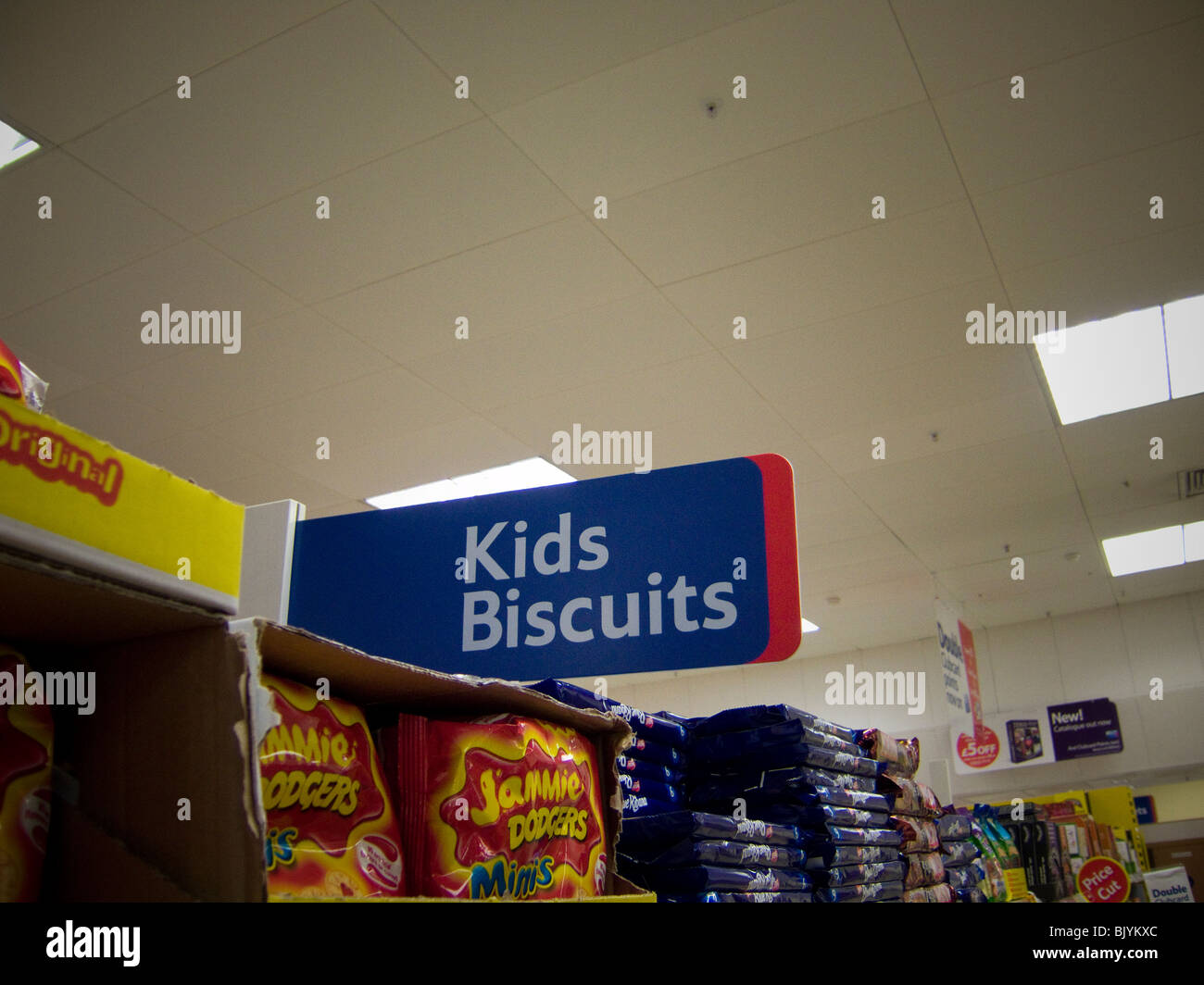 A 'Kids Biscuits' sign in a Tesco store in the UK. Stock Photo