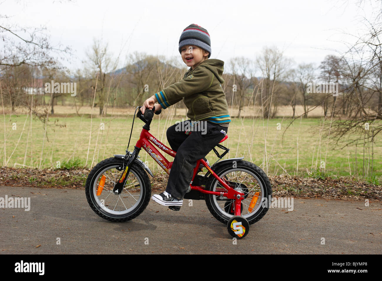 Boy Learning to Ride Bicycle Stock Photo Alamy