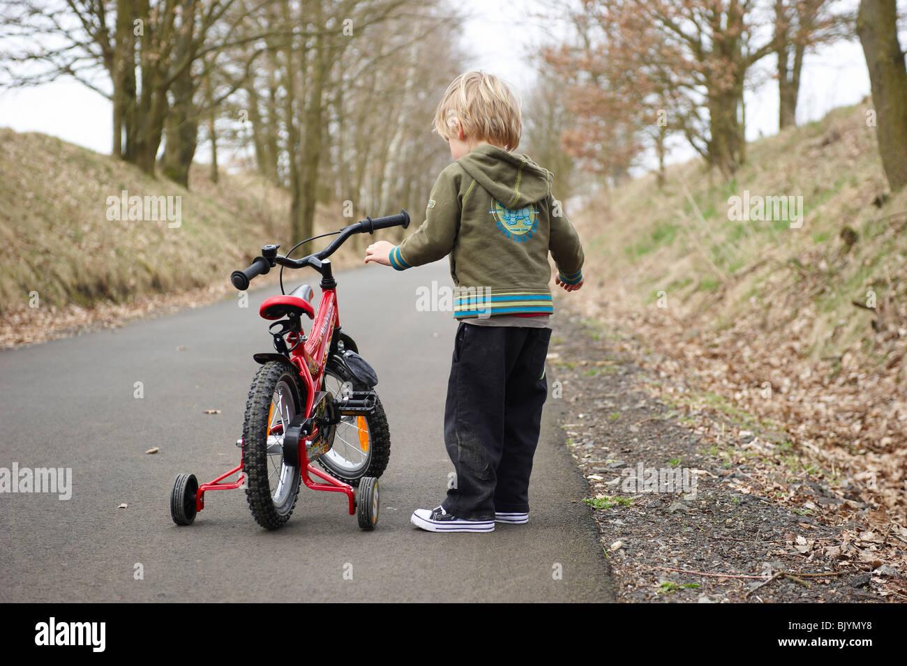 Boy Learning to Ride Bicycle Stock Photo Alamy