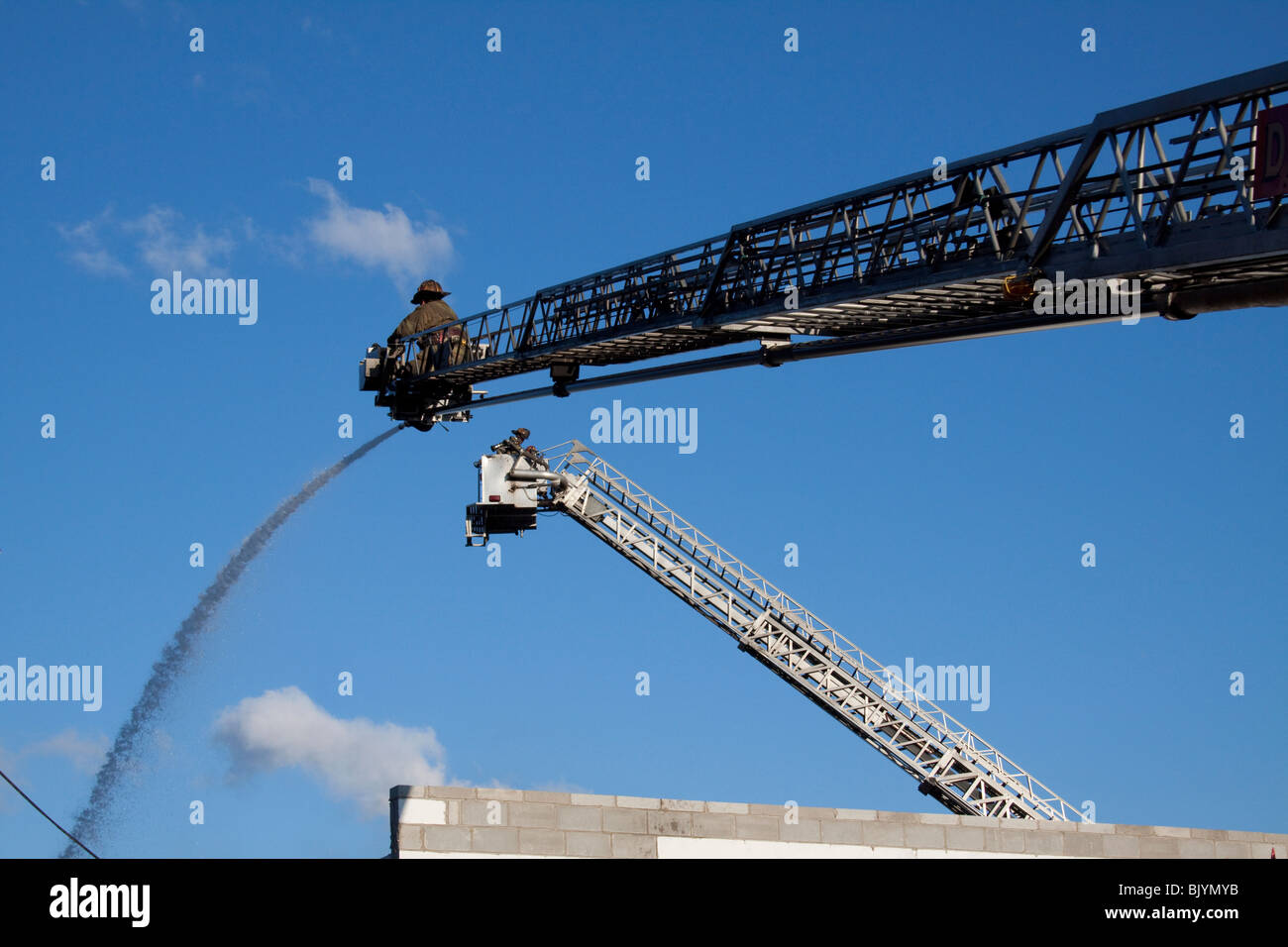 Two Aerial Ladders operate at 2nd Alarm Fire Detroit Michigan USA by Dembinsky Photo Assoc Stock Photo