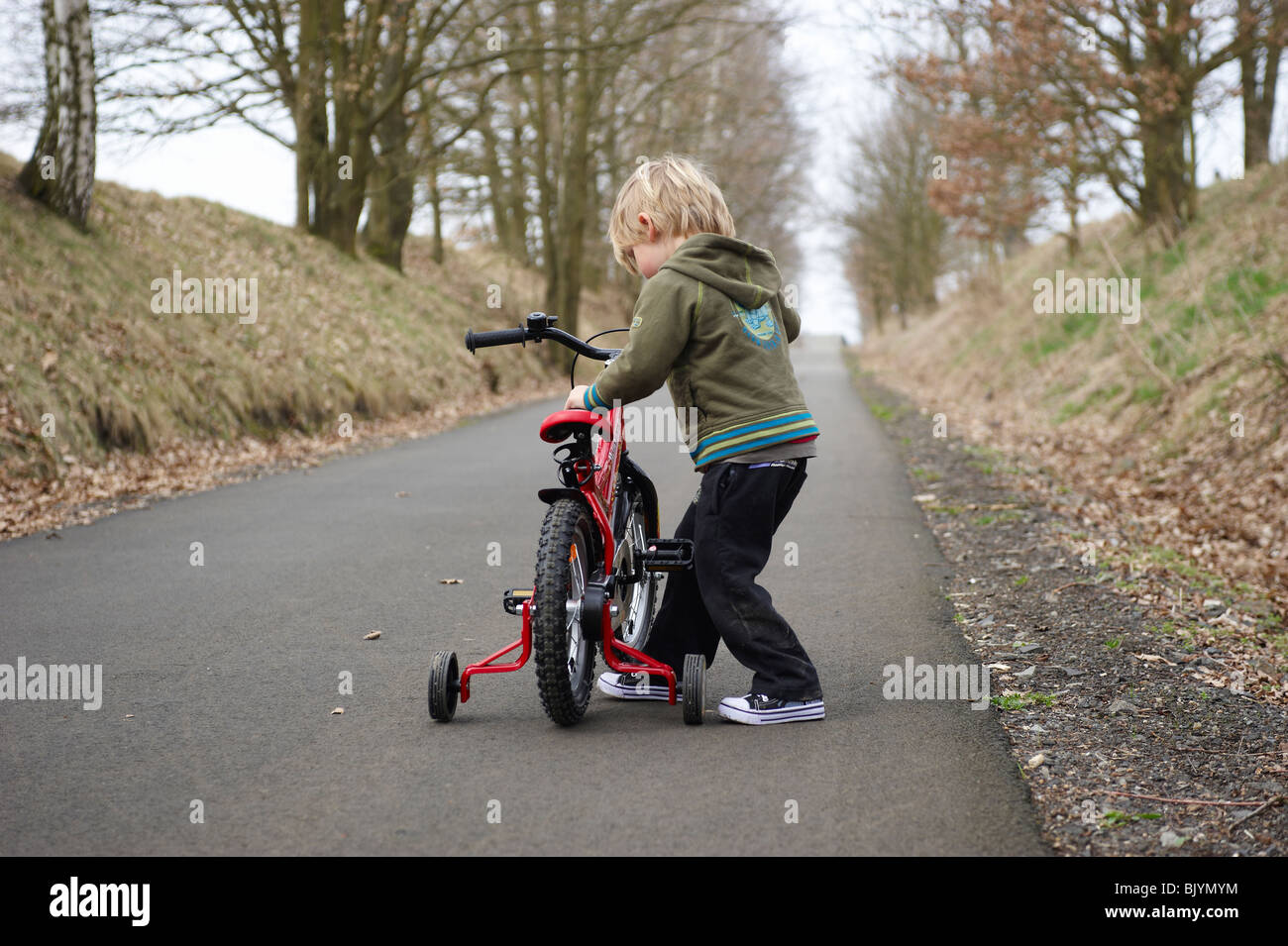 Boy Learning to Ride Bicycle Stock Photo Alamy