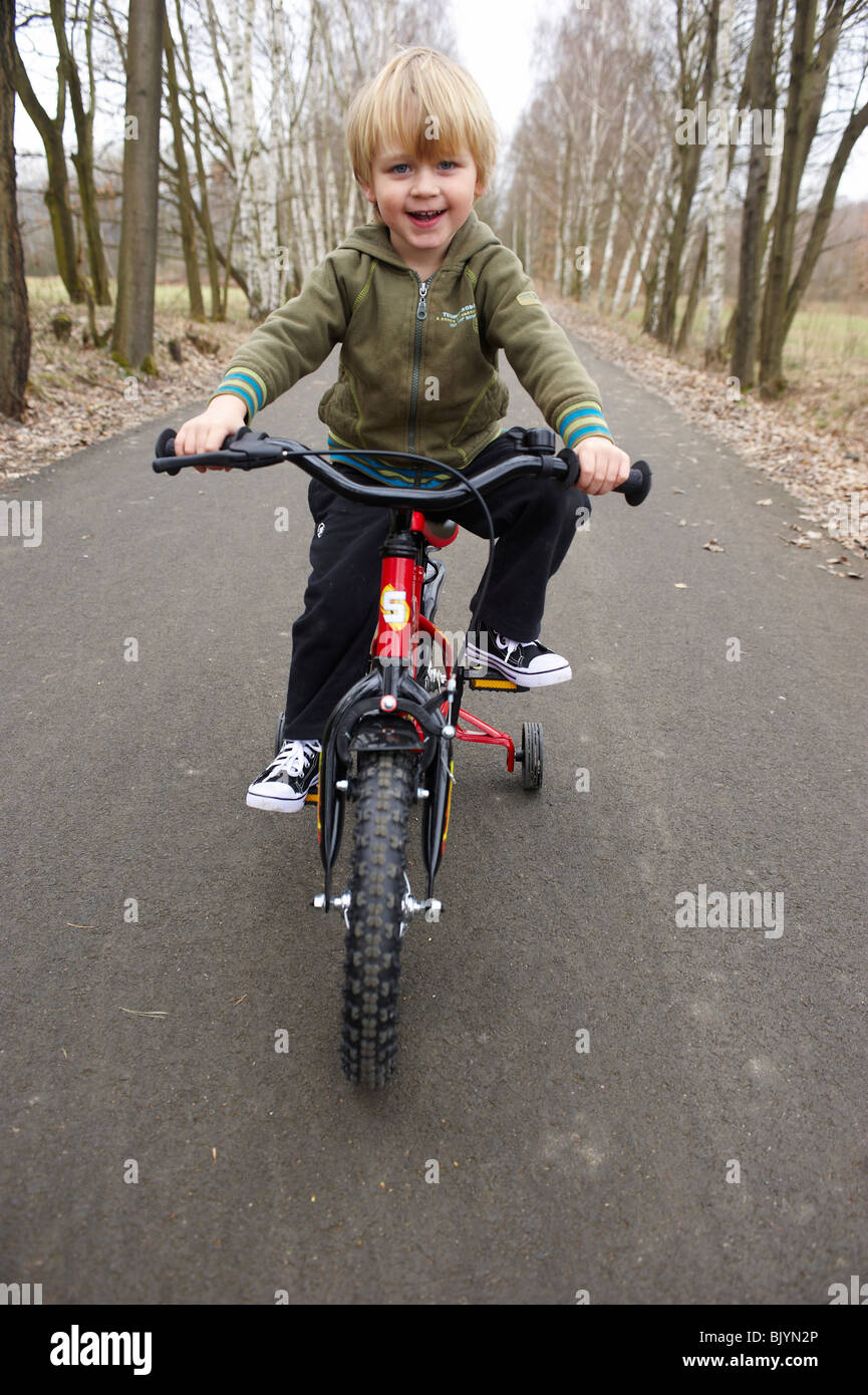 Boy Learning to Ride Bicycle Stock Photo - Alamy