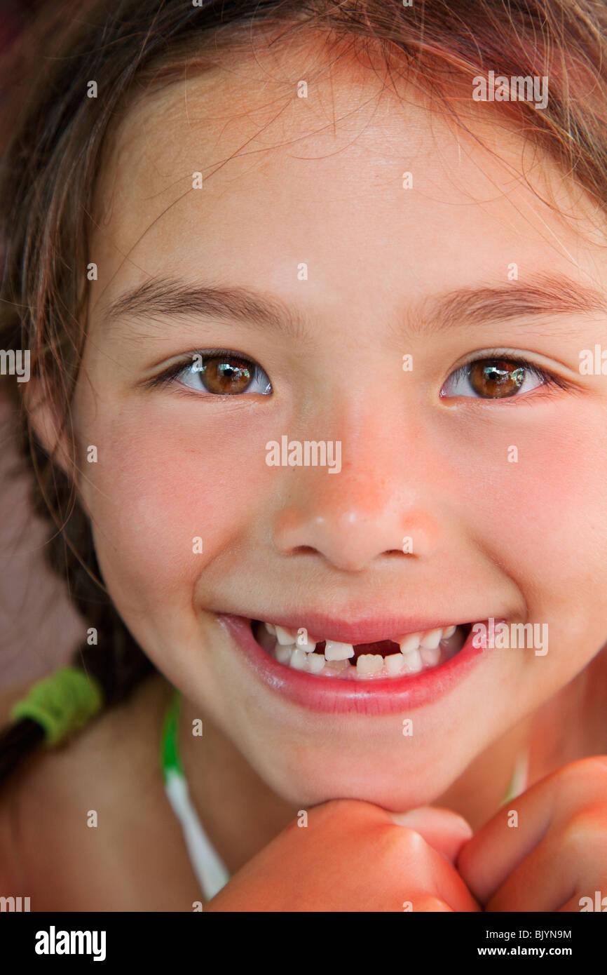 Mixed race girl with tooth missing Stock Photo