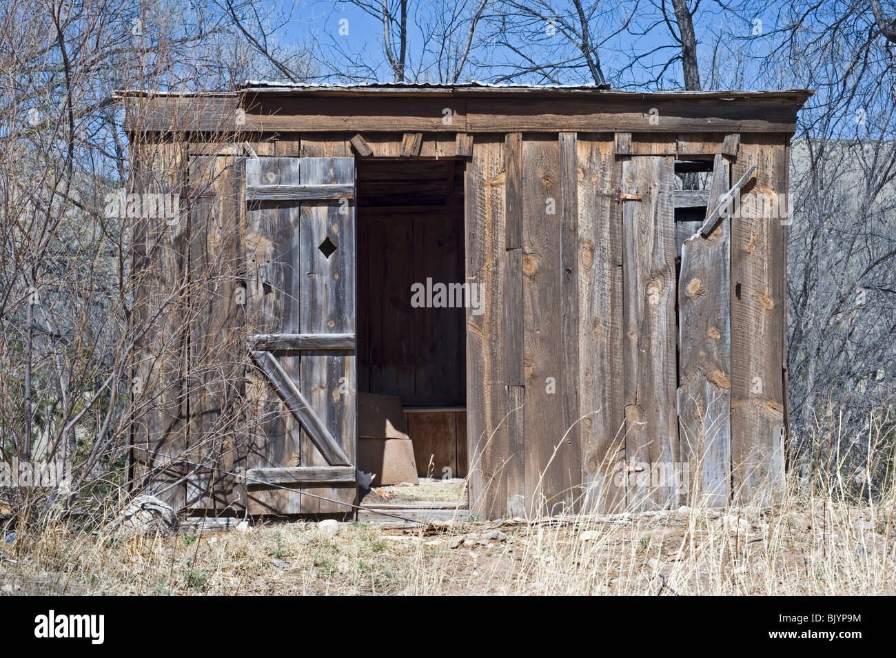 'Billy the Kid' may have relieved himself in this old-fashioned out-house found in Lincoln, New Mexico. Stock Photo