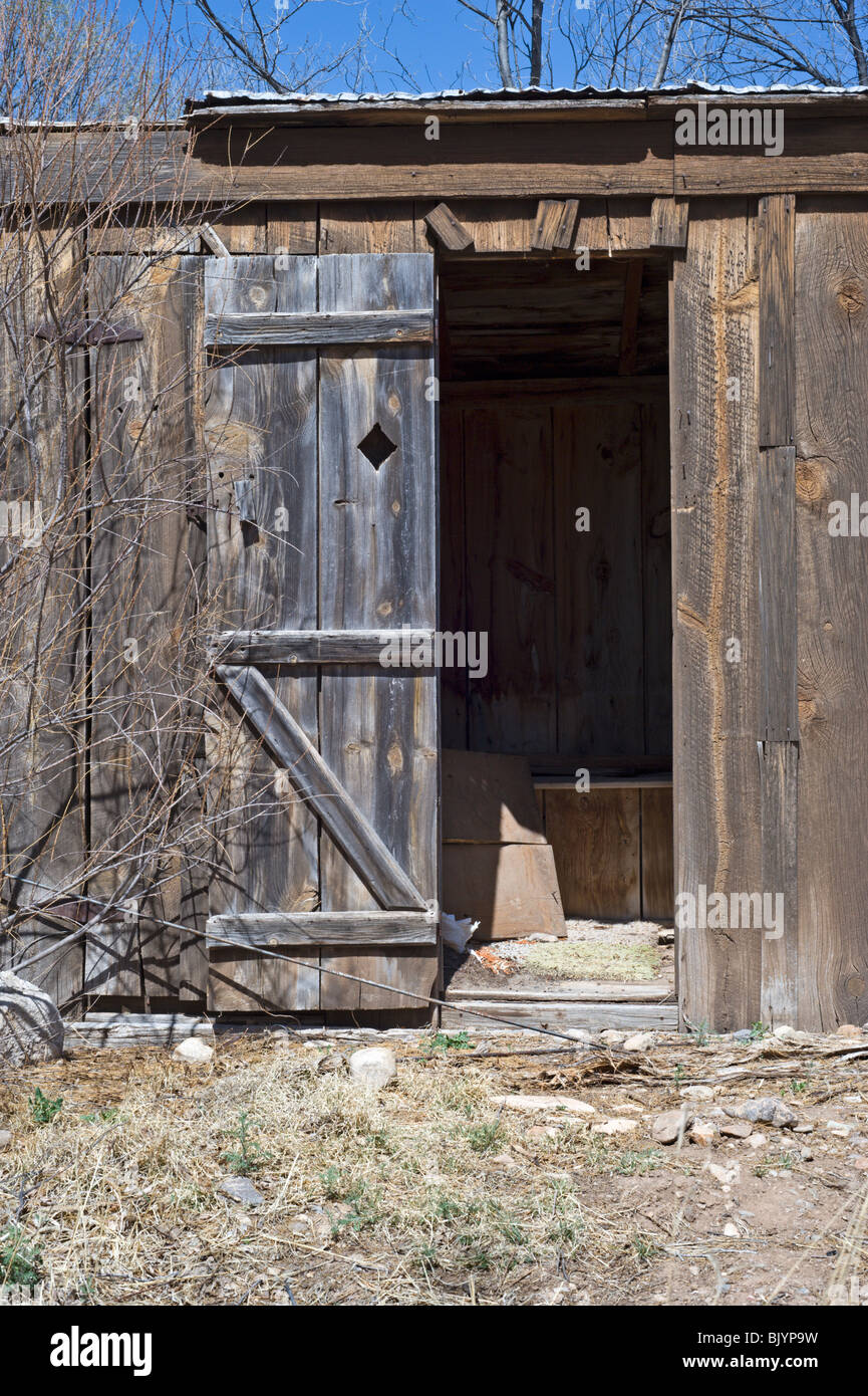 'Billy the Kid' may have relieved himself in this old-fashioned out-house found in Lincoln, New Mexico. Stock Photo