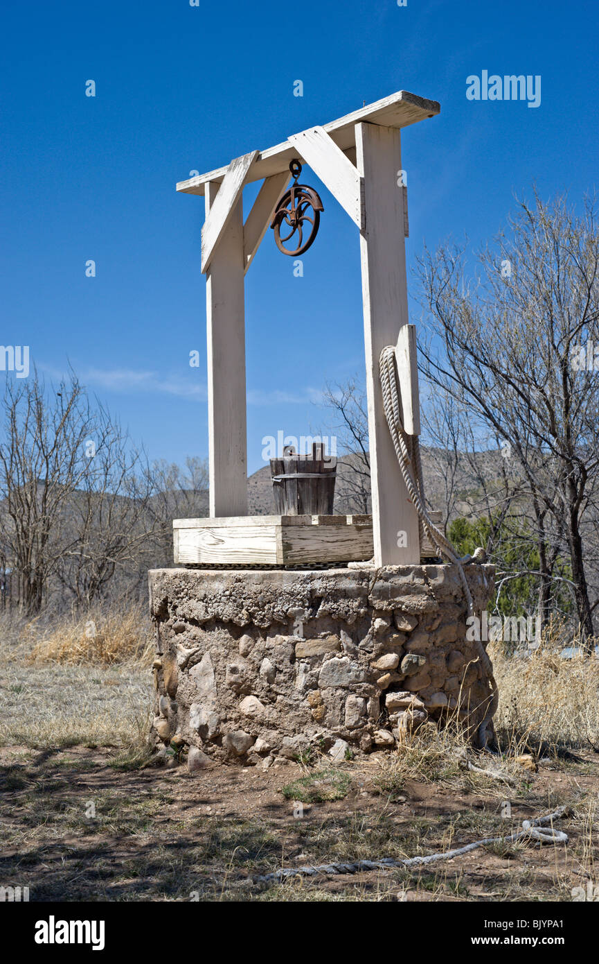 'Billy the Kid' may have quenched his thirst at this old water well found in the wild west town of Lincoln, New Mexico. Stock Photo