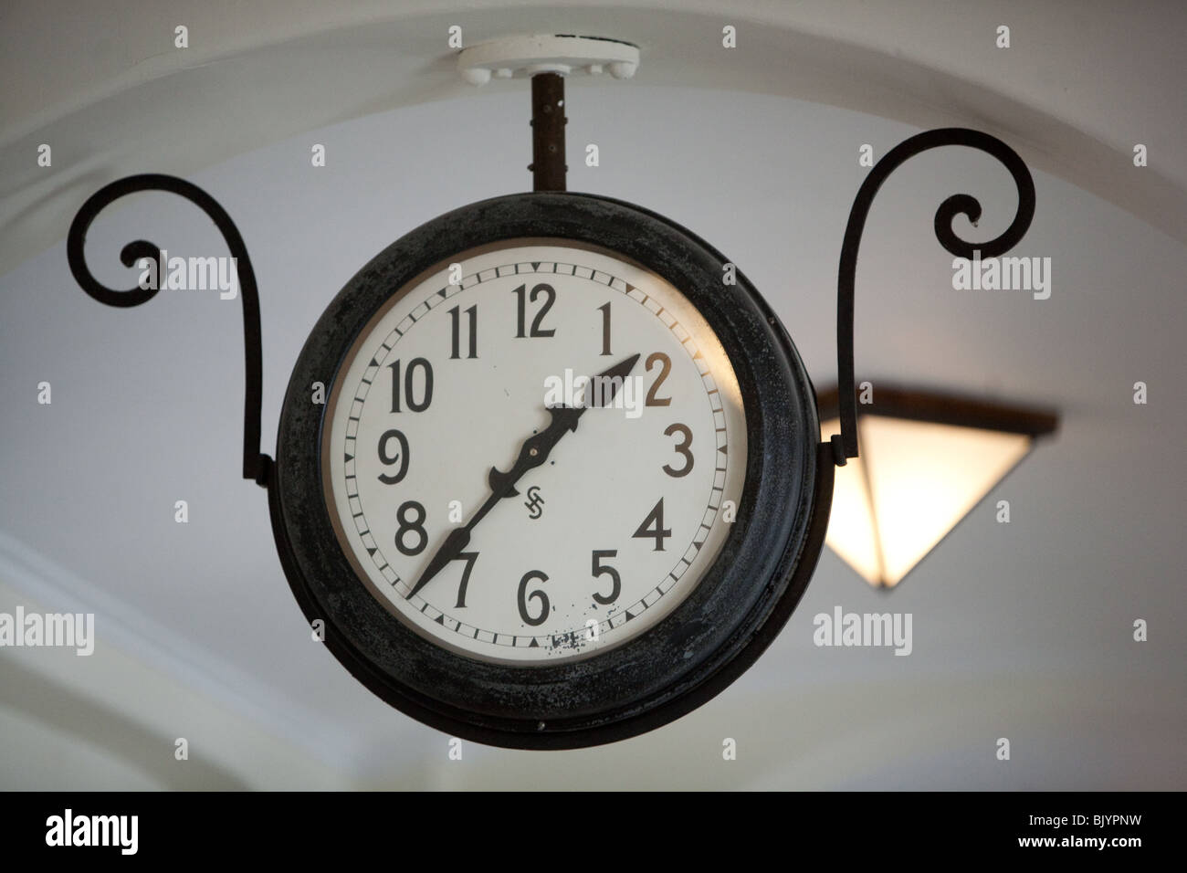 old style clock hanging in university hallway corridor Stock Photo Alamy