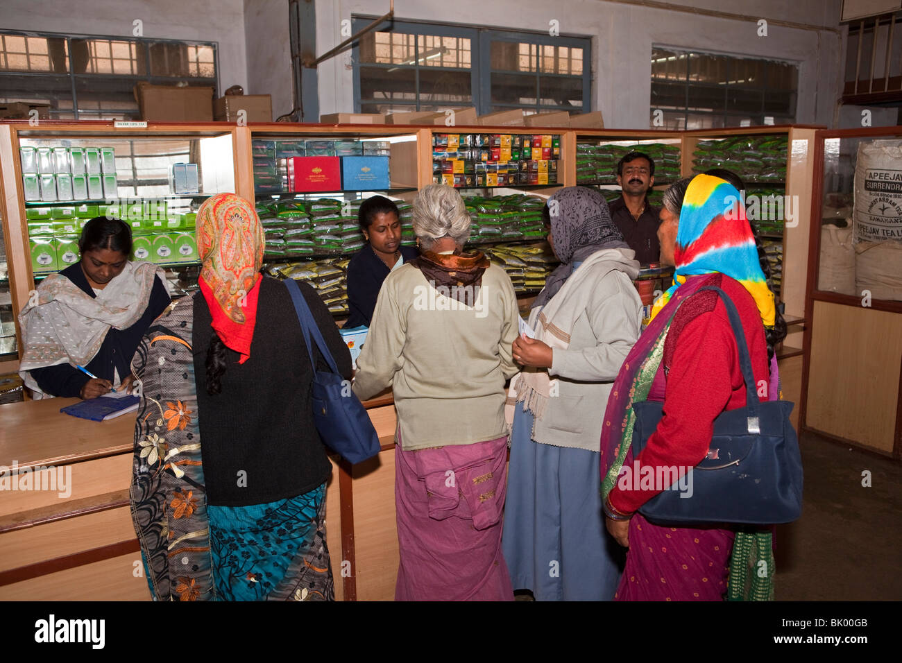 India, Tamil Nadu, Udhagamandalam (Ooty), Doddabetta tea factory, Indian tourists buying processed packaged tea in factory shop Stock Photo