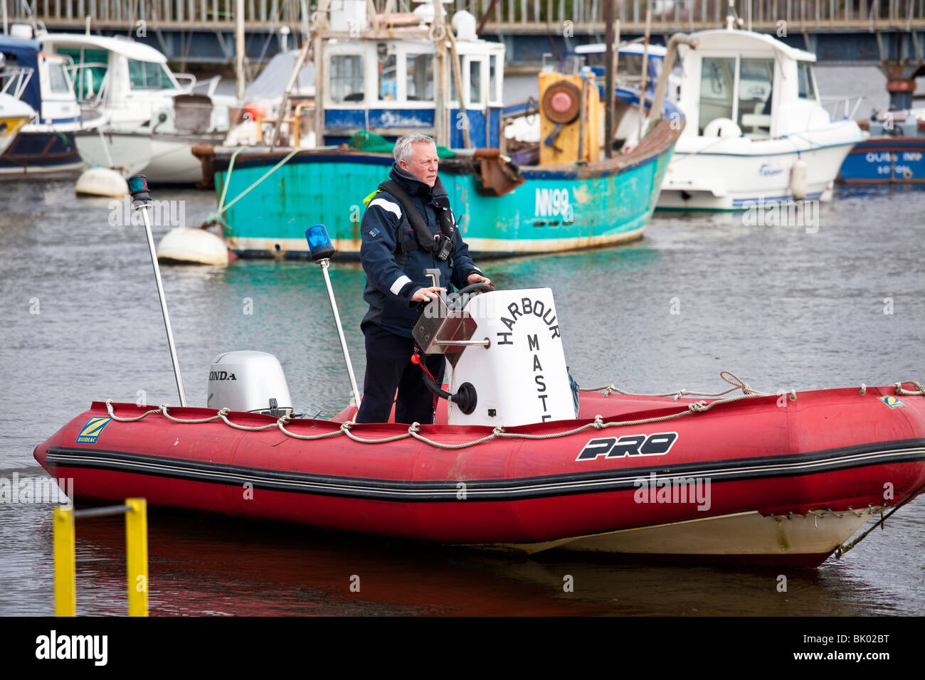 Lymington marina harbour master in inflatable rib boat Stock Photo Alamy