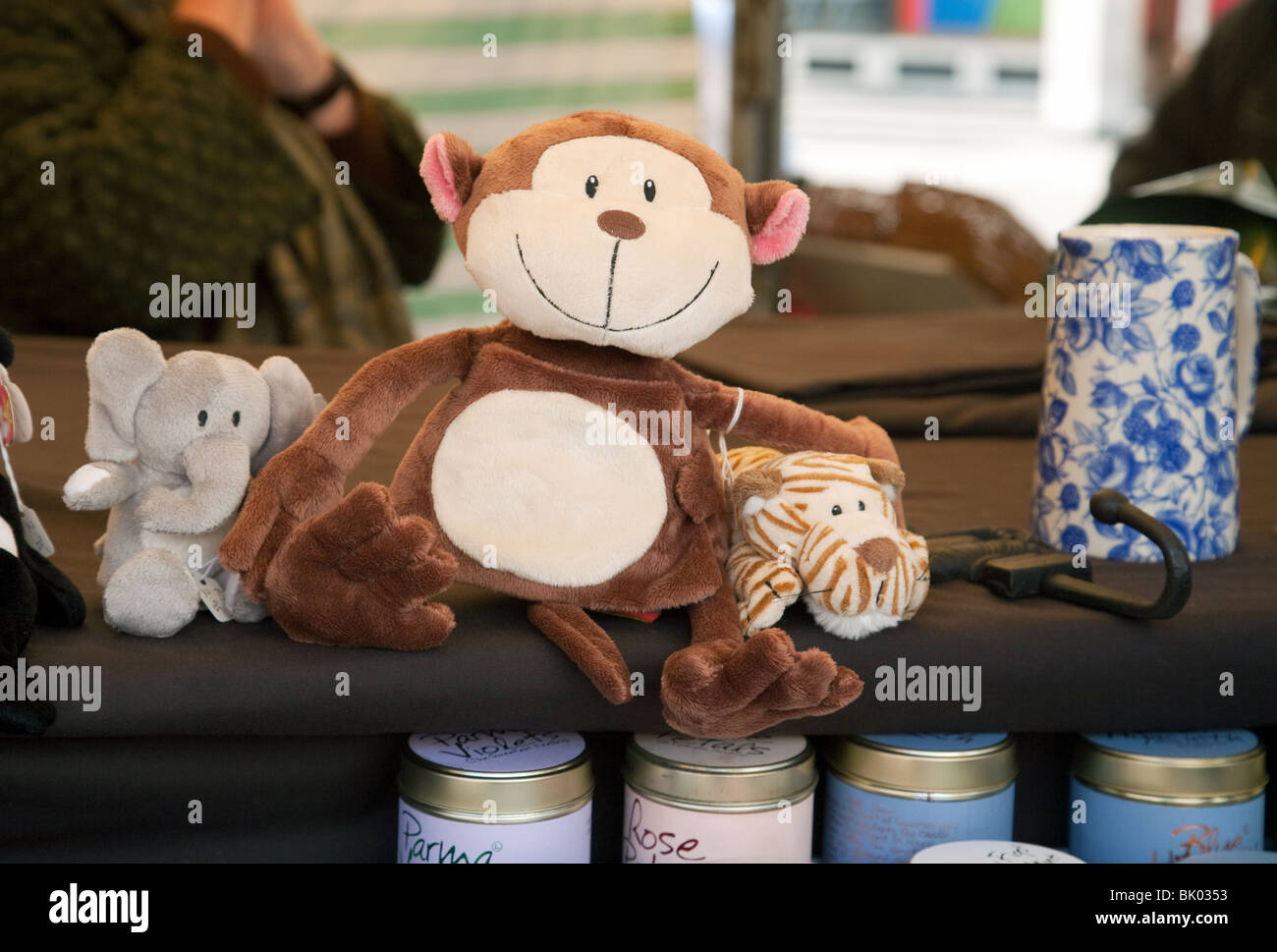 A stuffed monkey for sale, The market, Market Square, Cambridge, UK Stock Photo