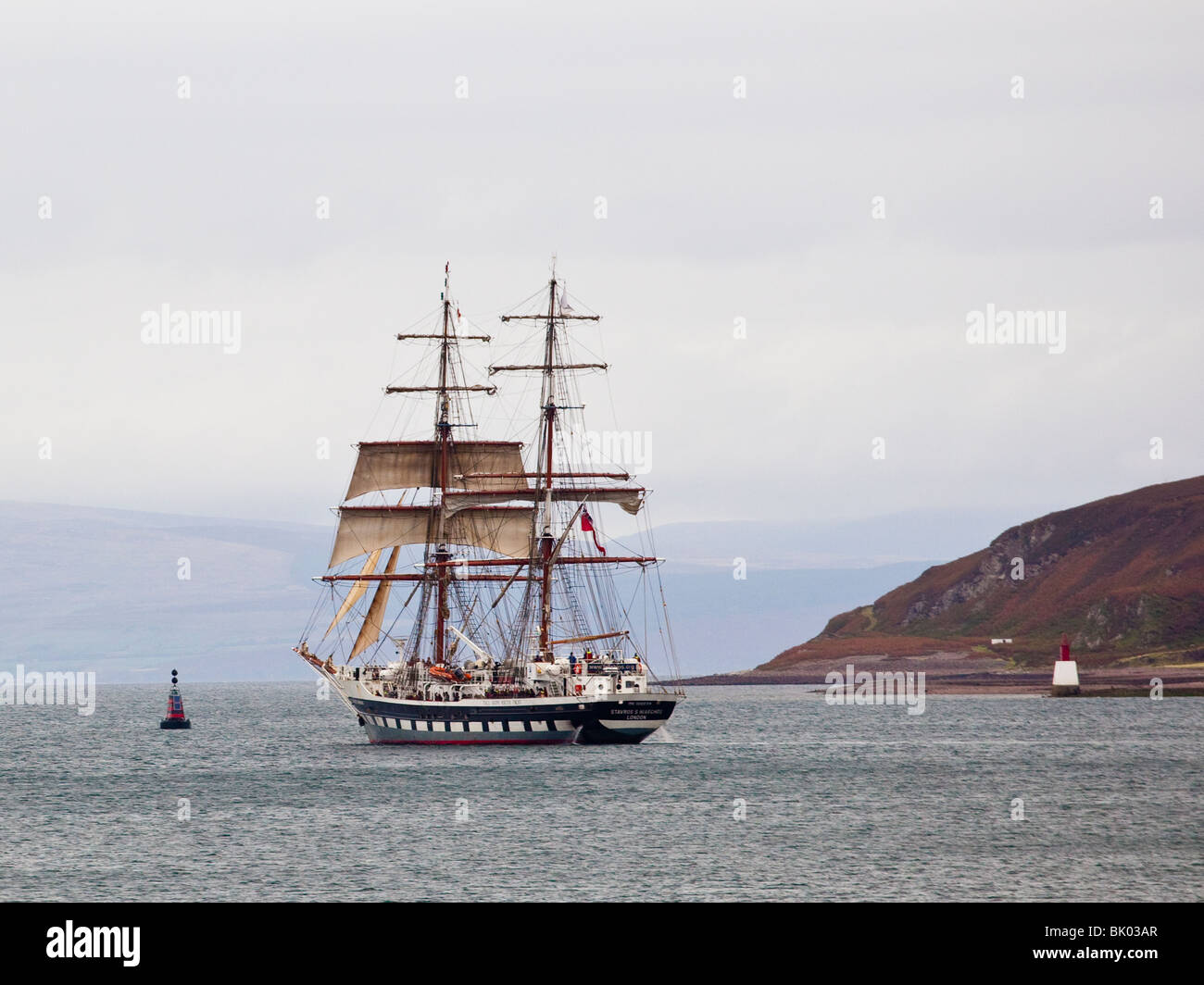 Tall Ship leaving Campbeltown loch Stock Photo
