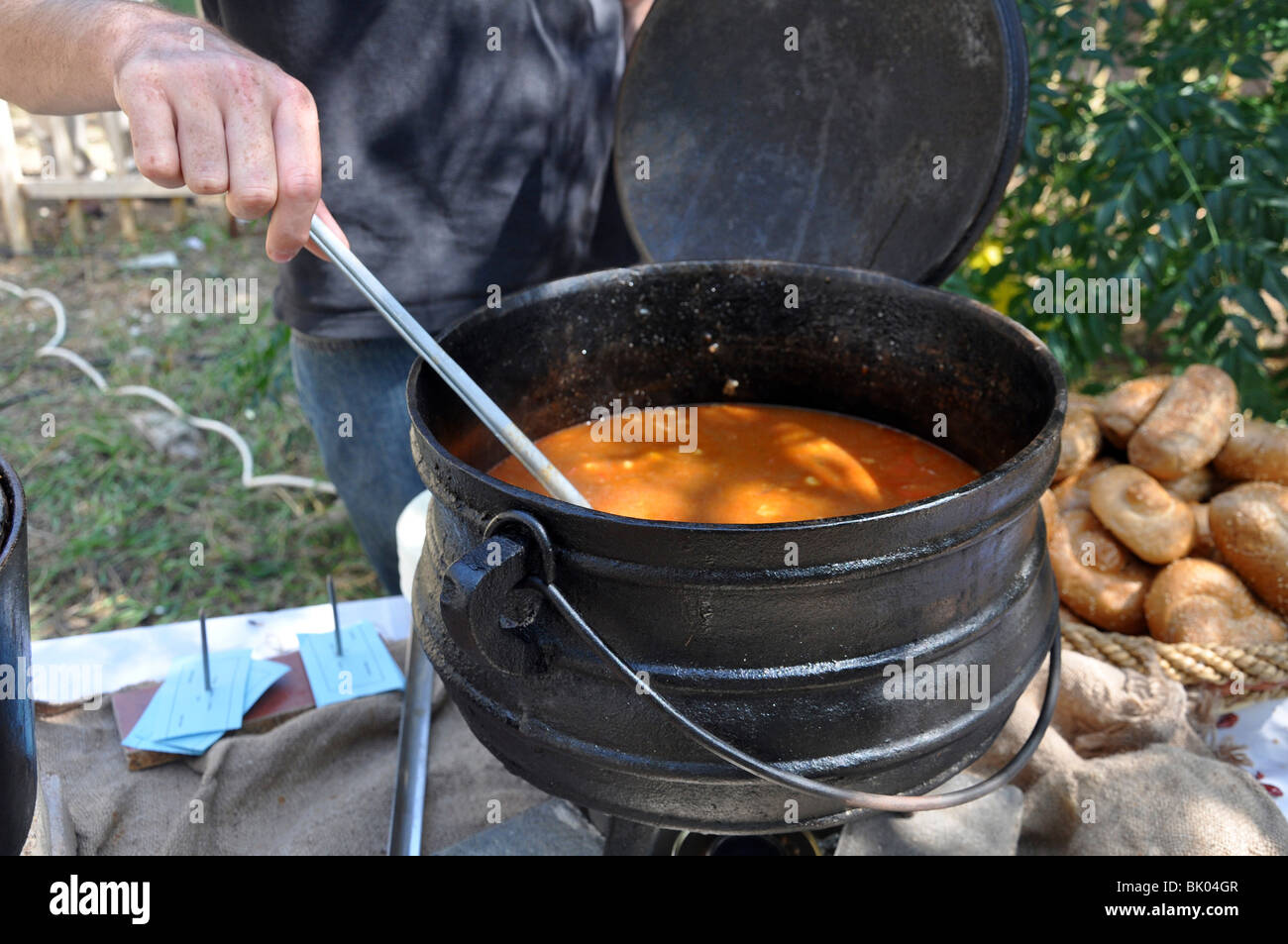 Outdoor cooking - a pot of simmering Goulash A Hungarian meat stew Stock Photo