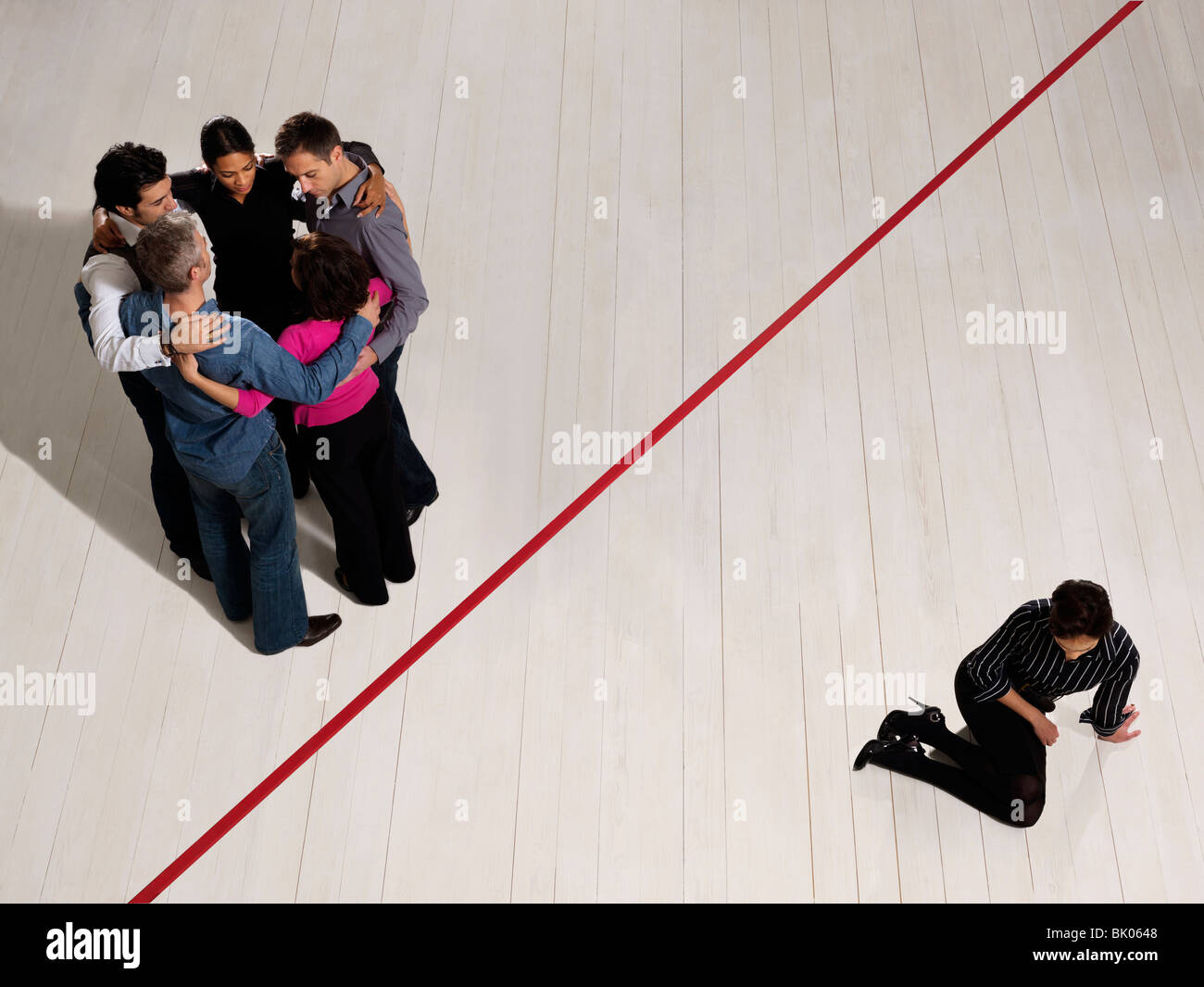 Business people divided by red line Stock Photo