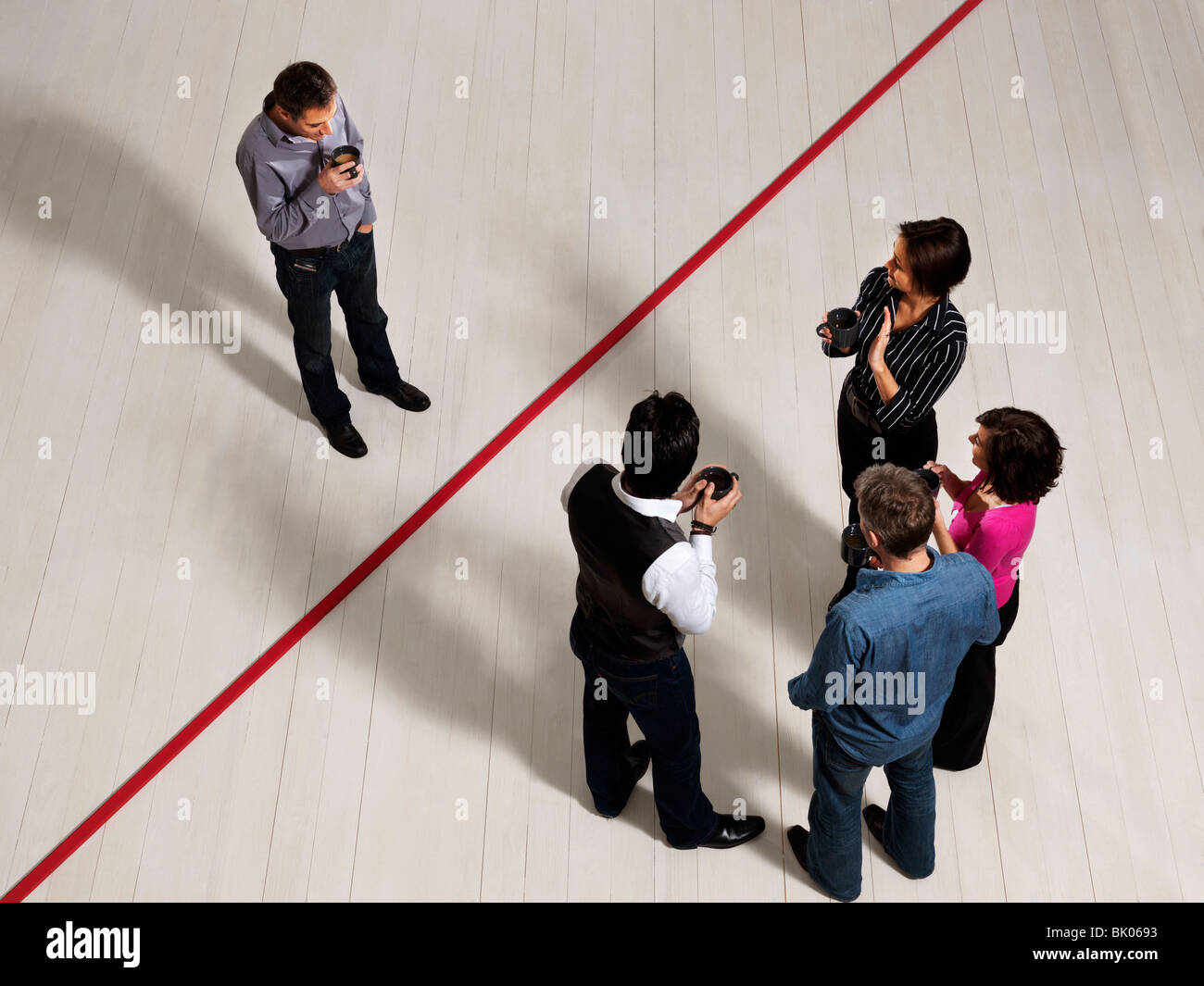 Business men and women by red line Stock Photo