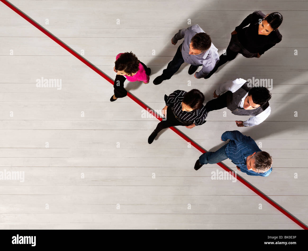 Business people crossing a red line Stock Photo