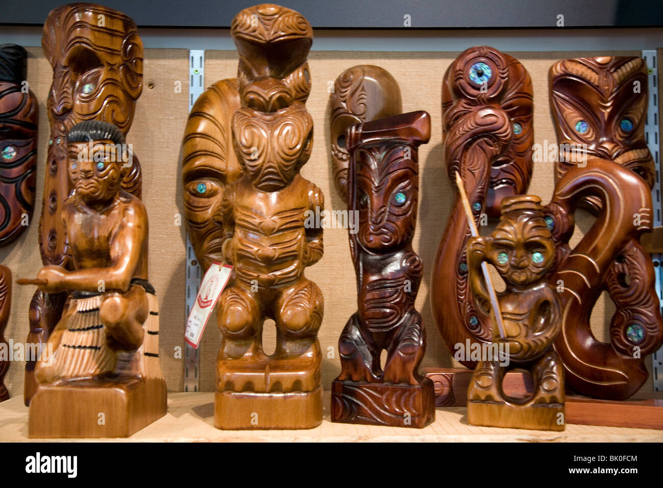 Wood carvings in Maori culture can be found decorating traditional structures and as art sculptures throughout New Zealand Stock Photo