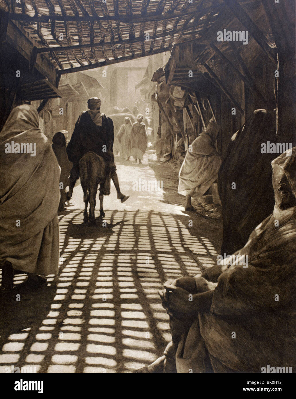 In a Moroccan market place, or medina, in the early 20th century. Stock Photo