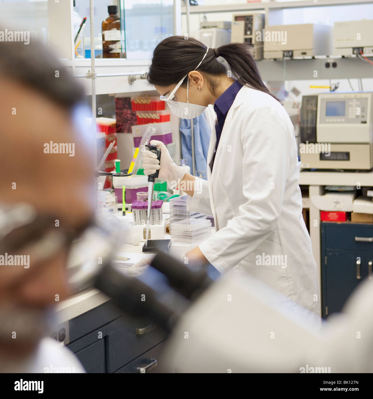 Indian scientist working in laboratory Stock Photo