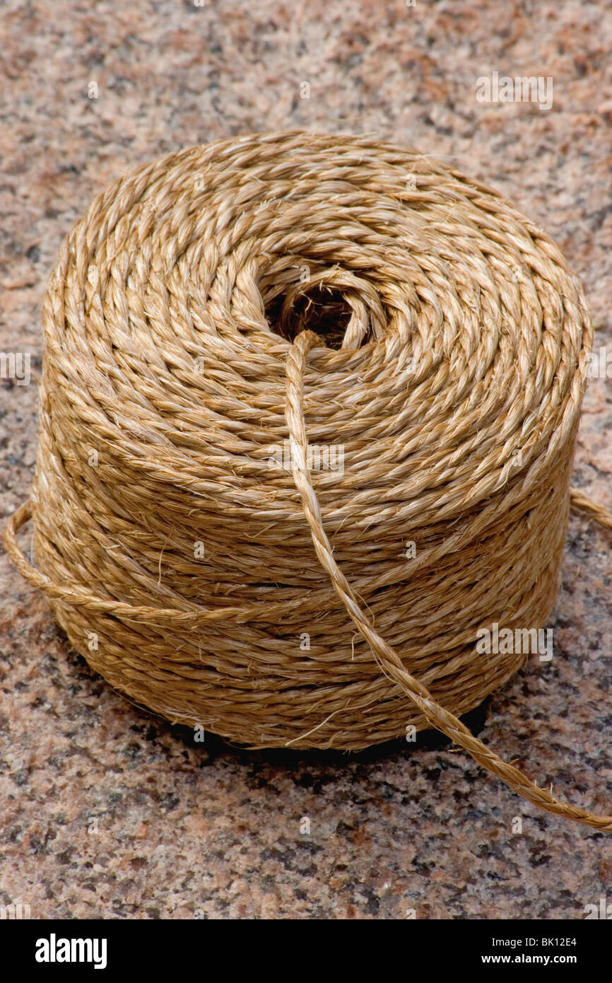 Spool of twine on granite background Stock Photo