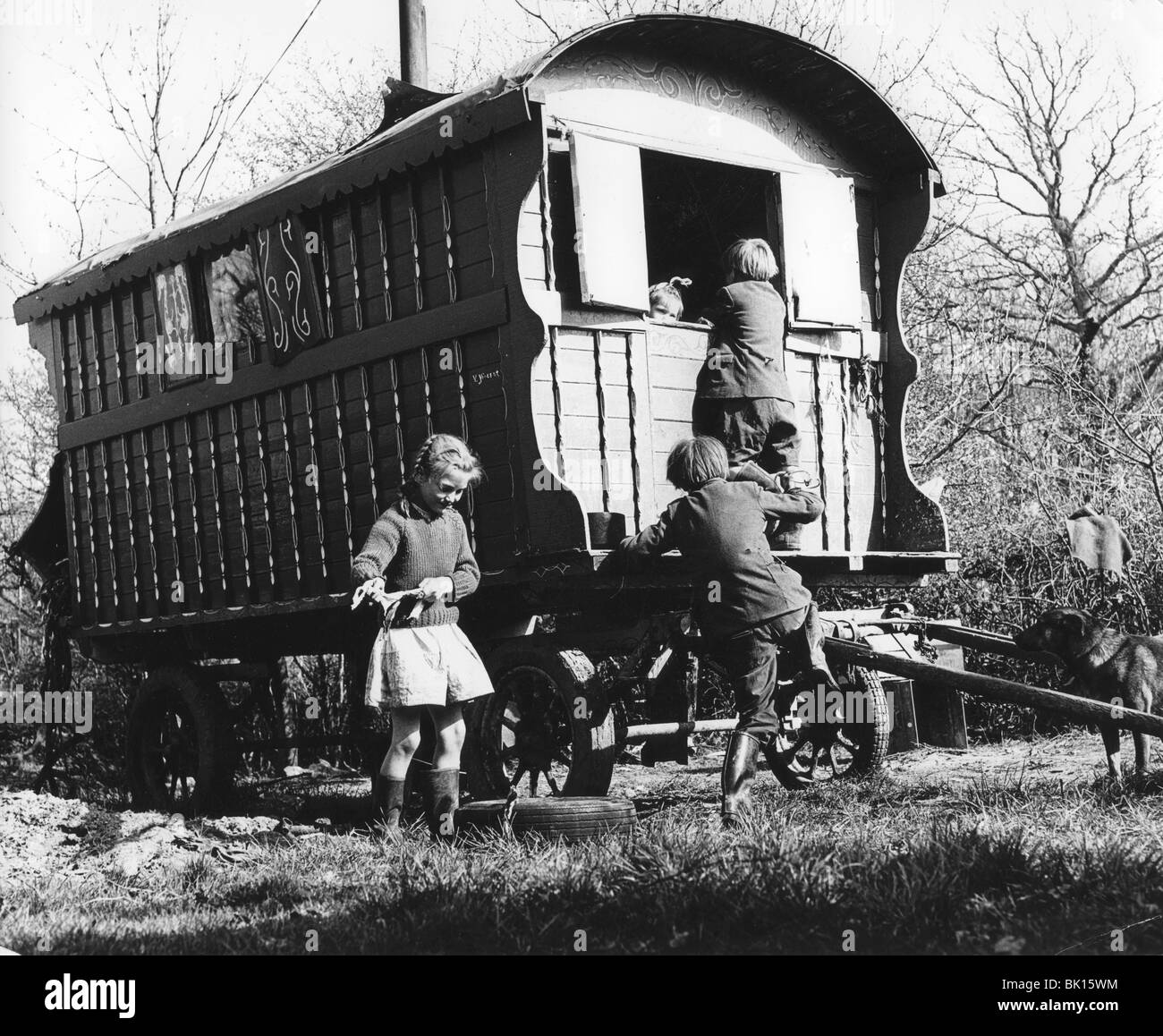 Gypsy children playing outside their caravan, 1960s. Stock Photo