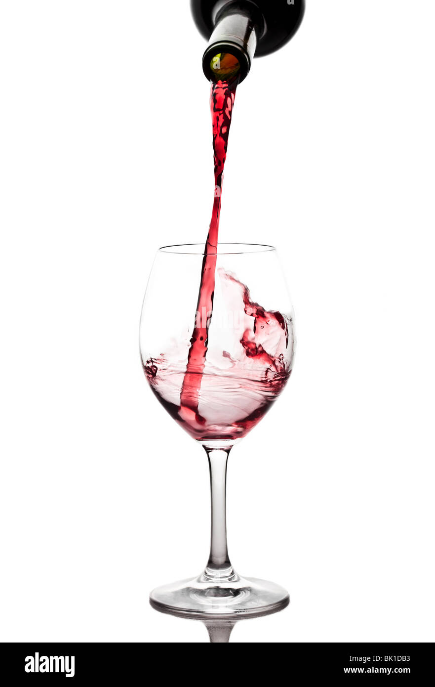 Red wine pouring into a wine glass Stock Photo