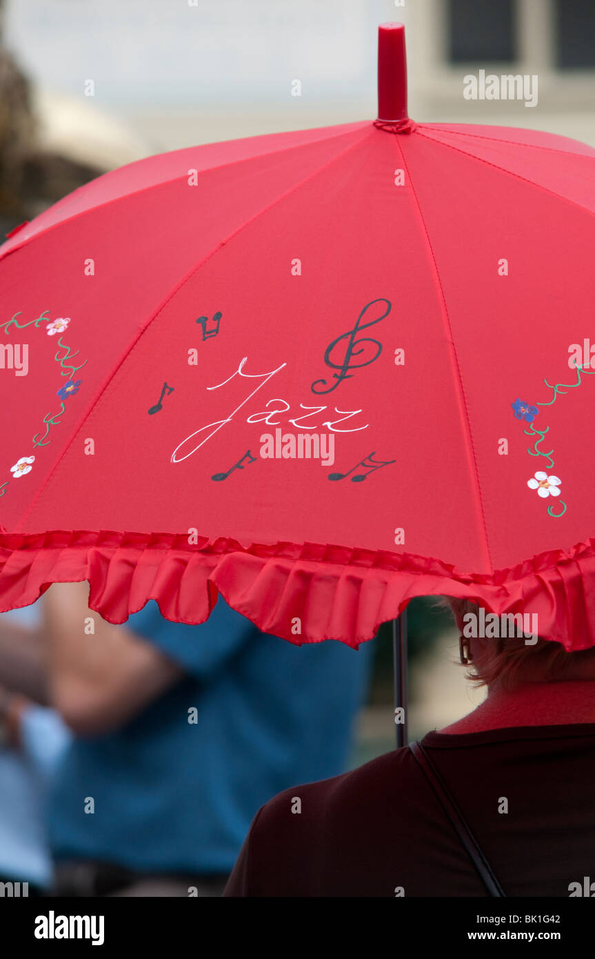 red Jazz umbrella in Sheringham Norfolk East Anglia England UK Stock