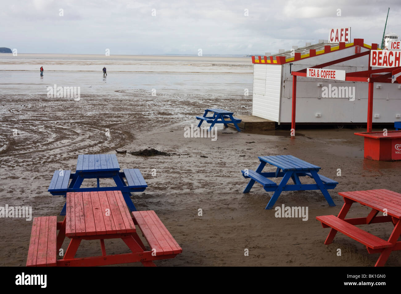 Dull seaside landscape showing empty kiosk picnic benches at Weston-super-Mare in Somerset. Stock Photo