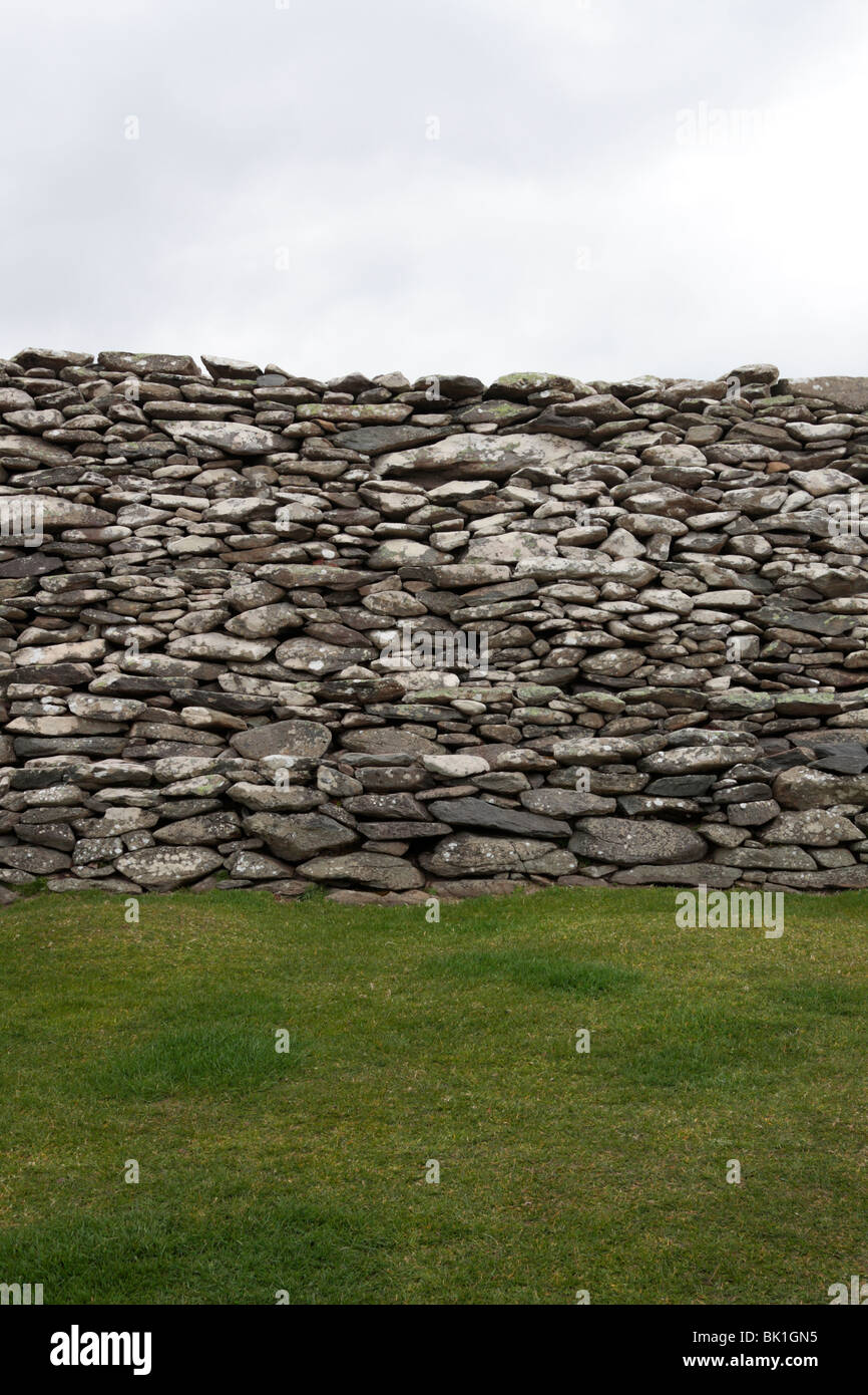 Stone defensive wall forming part of an Iron Age fort Dunbeg on the Dingle Peninsula County Kerry Ireland Stock Photo
