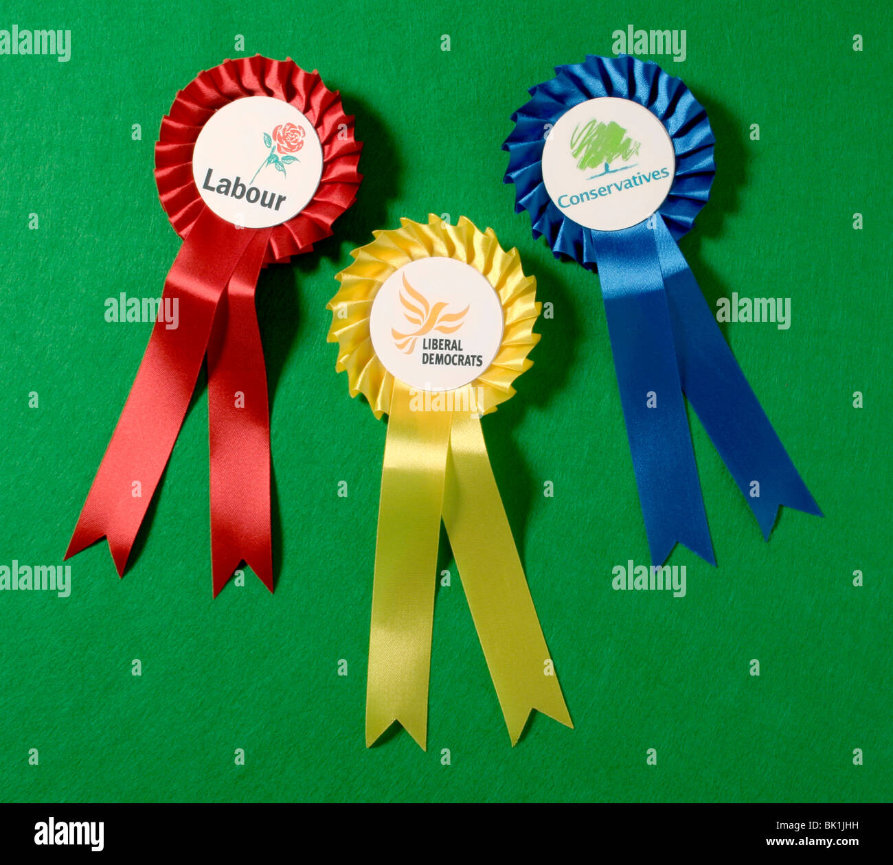 The three main UK political parties rosettes. Stock Photo