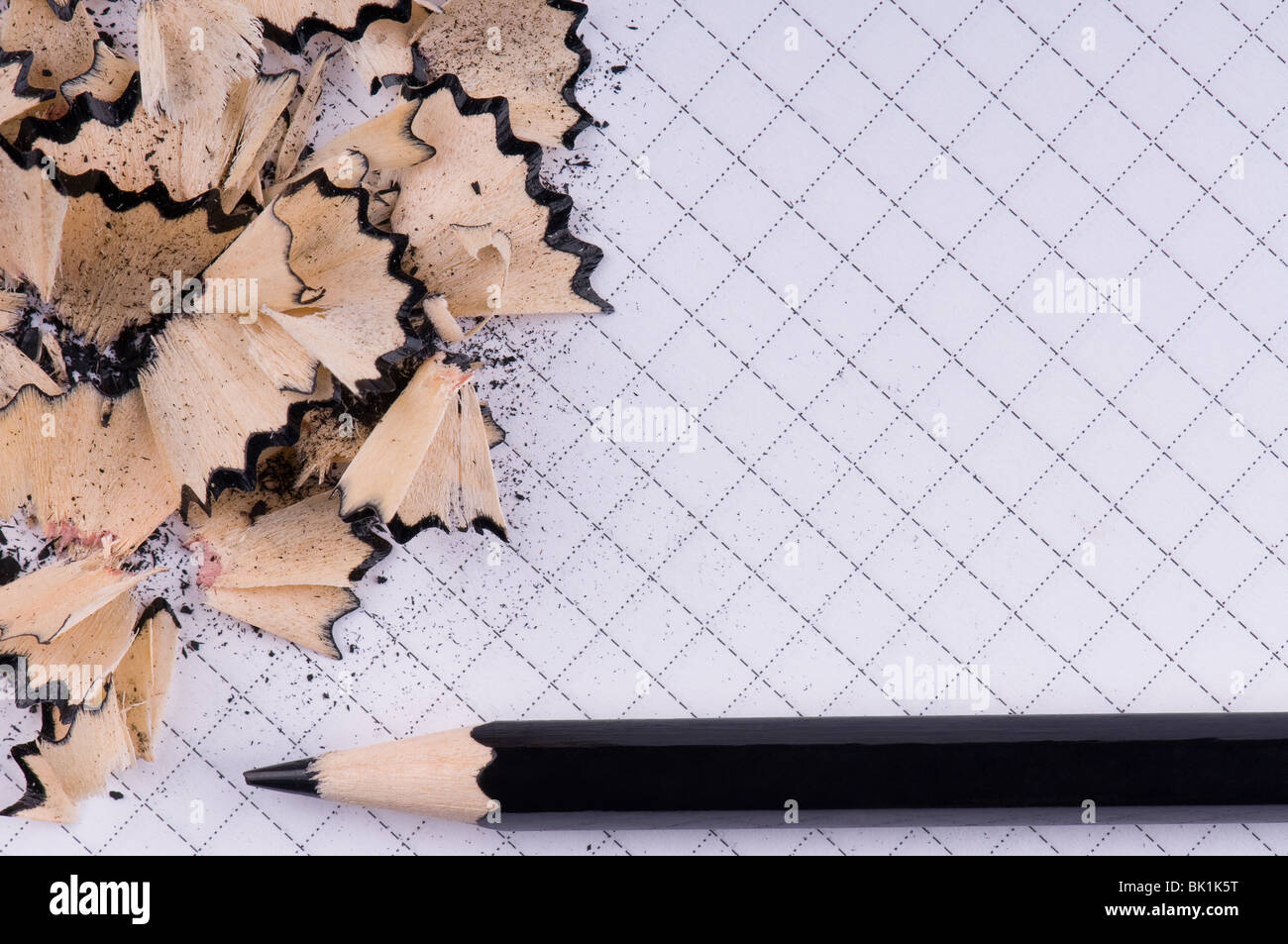 The black pencil and wood shavings background Stock Photo