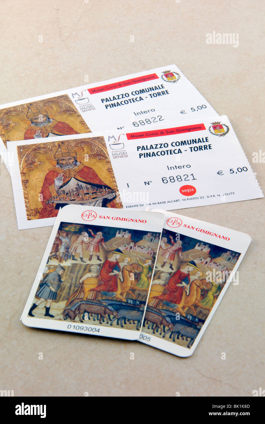 Two entrance tickets to two main sights of the San Gimignano. Palazzo Comunale has Pinacoteca, which has paintings from Sienese Stock Photo