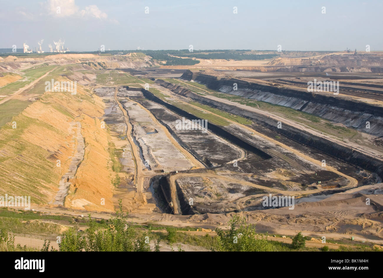 Opencast mining with coal power station Stock Photo