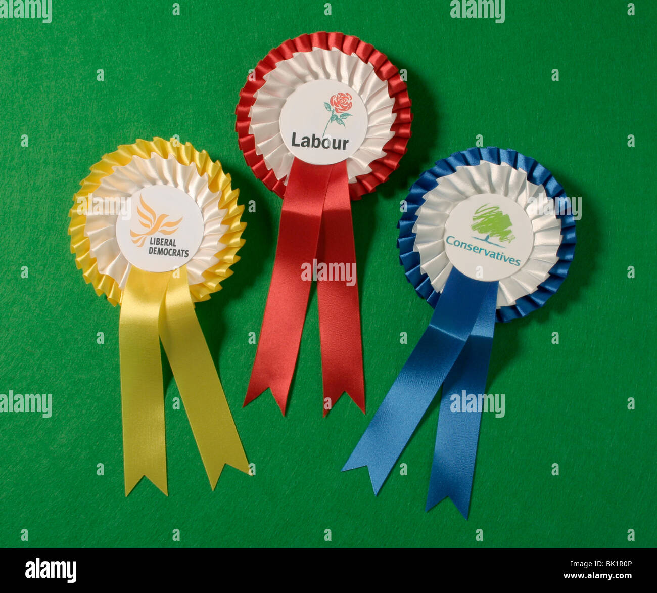 The three main UK political parties rosettes. Stock Photo