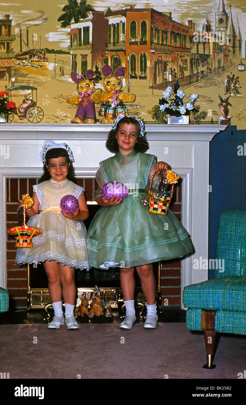 Two American girls pose with their Easter eggs in the 1950s Stock Photo