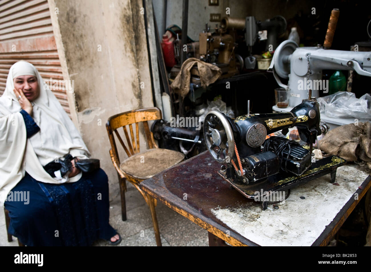 An old Singer sowing machine is still in use in Cairo Stock Photo - Alamy